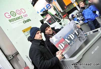 andrew call(l) and omar lopez-cepero, cast members of green day's broadway musical 'american idiot', prepare to shred a bad memory provided by green day frontman billie joe armstrong at the fourth annual good riddance day in new york's times square.